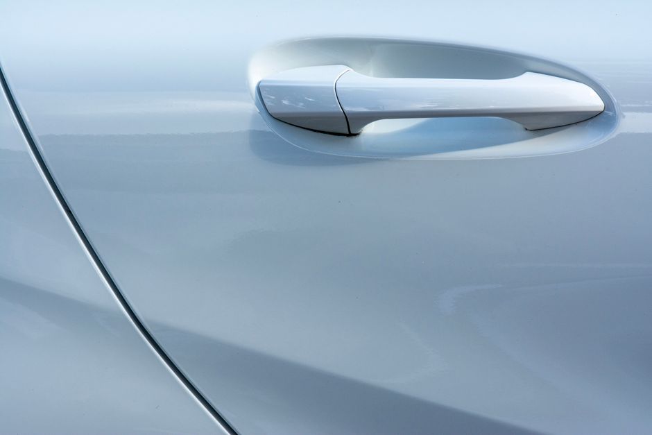 Glossy luxury car exterior showcasing flawless ceramic coating